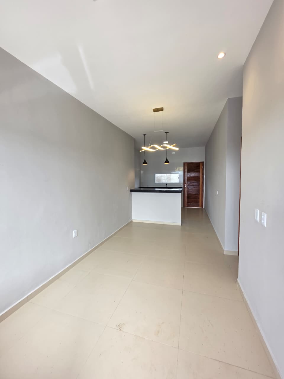 Sala integrada com cozinha americana